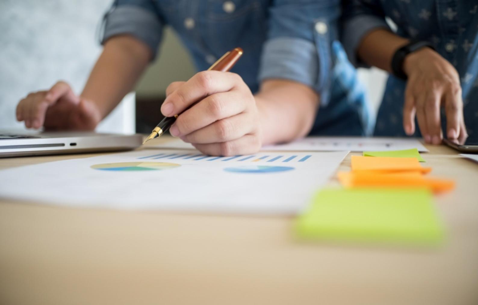 Financial analysis workspace with documents and charts